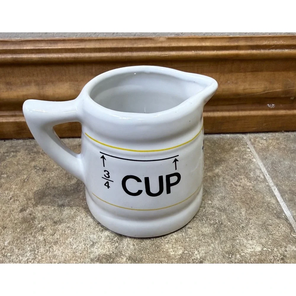 Vintage ceramic‎ 3/4 cup measuring pitcher with charming floral design.